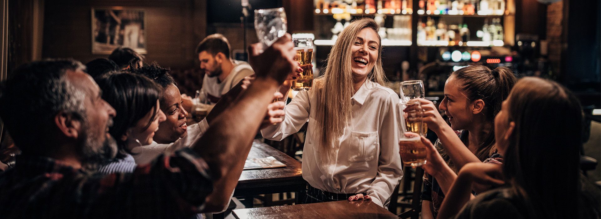 people enjoying a drink at a bar